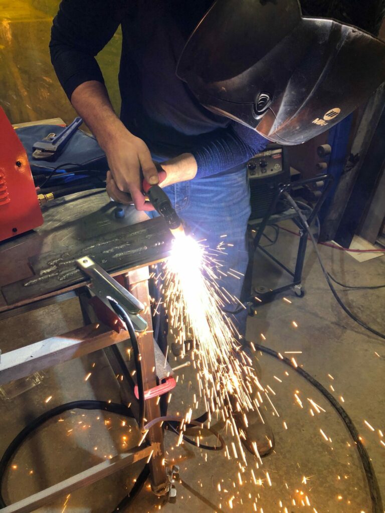 Sparks fly during a welding class at NewMakeIt